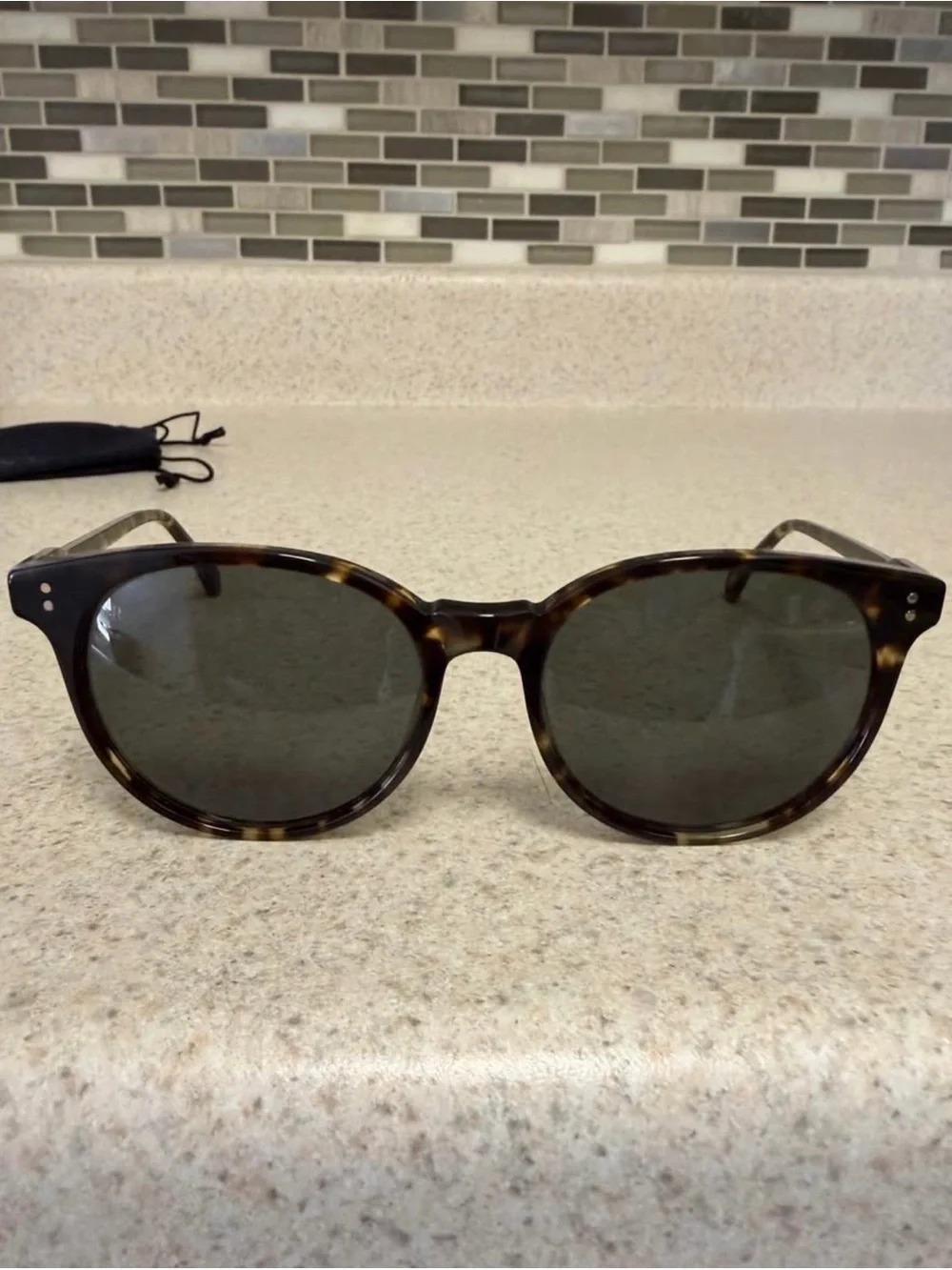 RAEN Tortoiseshell Round Sunglasses with Dark Lenses